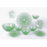A 20th Century moulded green glass pudding set comprised of a bowl and stand, diameter 27cm,