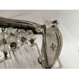 A Liberty Art Nouveau style chandelier, of sinous organic form, retailed by Liberty in the last