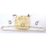 A pearl necklace and earing group in Oriental drawstring bag, length of necklace 31cm