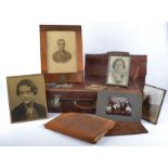 An early 20th Century travel trunk containing a framed military portrait in a regimental frame '