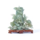 A Chinese 'New Jade' bowenite serpentine rose and exotic bird vase and cover, height 24cm