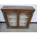 A 19th century walnut veneered pier cabinet, box wood stringing, gilt metal mounts and two shelves