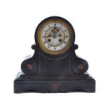 An early 20th Century black slate mantle clock, with white enamel dial, with Roman numerals in a