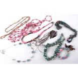 A quantity of costume jewellery to include mother of pearl strung with beads tinted in pinks and