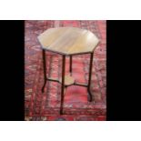 An Arts and Crafts walnut octagonal drop leaf occasional table, with swivel solid legs to lock in