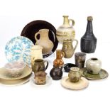 A collection of contemporary stoneware ceramics, including plates, jugs, serving dishes, decorated