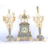 A early 20th Century French marble mantle three piece clock garniture, grey enamel dial with