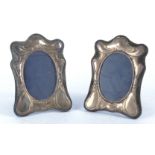 A pair of hallmarked silver Art Nouveau style frames with sinuous organic decoration, by London