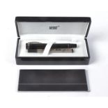 A black Mont Blanc ball point pen, in original retailers box with manual,4.5cm x 18cm x 8cm and card