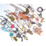 A collection of costume jewellery, beaded bracelets, keyrings, leather and metal necklaces, animal