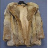 A ladies vintage fur jacket possibly racoon, grey and brown with revered collar, brown silk