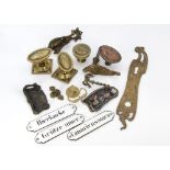 A collection of early 20th Century door furniture, including a bronzed Art Nouveau handle, another