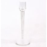 A St Louis glass candlestick with twisted stem, the base with printed St Louis France back stamp,