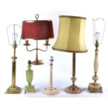 A group of nine assorted table lamps to include a brass two branch candelabra style table lamp,