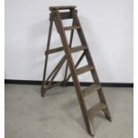 A vintage wooden pitch pine step ladder, six steps with a metal G A Jones patent label, height 147cm