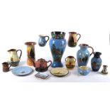 A group of Torquay Devon Ware pottery of various designs to include various pieces with designs of