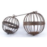 A graduated joining pair of spherical metalwork holders, for garden use, largest approximately 38cm