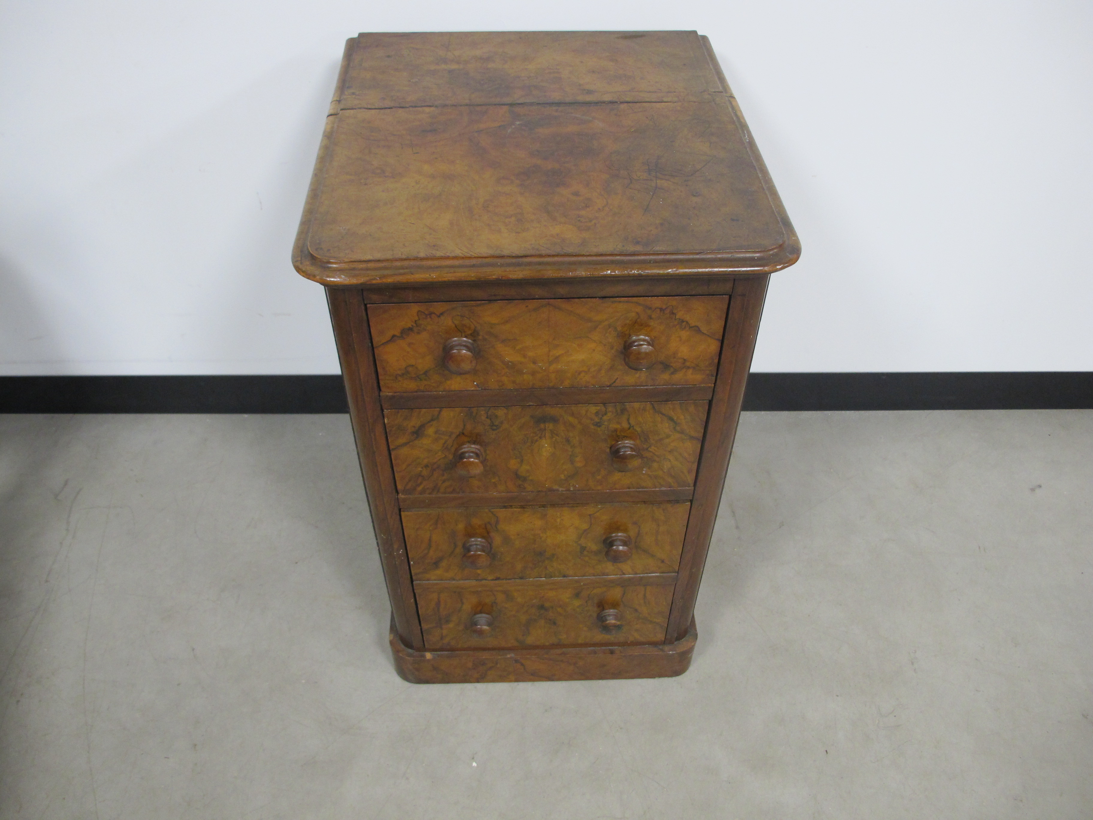 A 19th century burr walnut chest of narrow proportions, with two short drawers and one deep, moulded