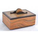 Paul Swan (Contemporary British) an aromatic man made veneer and bog oak box entitled 'wave motion',