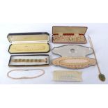 Four items of costume jewellery one a cased bracelet and necklace marked 'genuine jade', length of