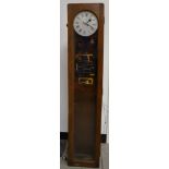 A Synchronome Co. Ltd electric wall clock, silvered dial with Roman numerals, 8.5v, the NRA plate