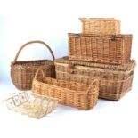 A collection of interior wicker objects to include seven baskets of assorted shapes and sizes,