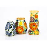 Three Art Deco Czechoslovakian pottery vases, two with similar decoration painted with colourful