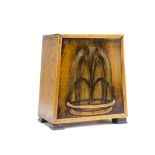 An Art Deco oak cased speaker, of triangular tapered form with pierced grill of fountain design,