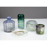 A collection of contemporary glassware, including a cylindrical blue shoulders vase with sloping