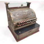 A cast brass 'National' cash register, factory number 738576, size 346, sold by the National Cash