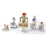 Six Victorian Staffordshire figures with animal subject matter to include an interesting example