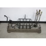 A collection of fire place furniture, metal log basket, antique pierced cast iron fender and brass