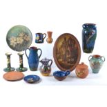 A group of Torquay Devon Ware pottery of various designs to include a group of wares with exotic