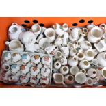 An extensive collection of crested china, in various forms, with British crests, including place