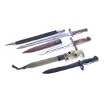 A group of three Spanish bayonets, including an M58, with makers mark and serial E44013, plus an