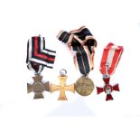 Four WWI German medals, comprising The German Cross of Honour 1914-18, marked N & H to reverse,