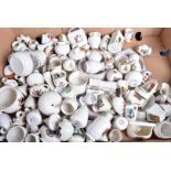 An extensive collection of crested china, in various forms, with British crests, including place