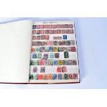 An album of British stamps, containing a Penny Black, marked EG, 23 Penny Reds and a Penny blue,