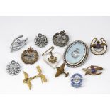 A group of Royal Air Force sweetheart brooches, comprising two wishbones, a Good Luck Horseshoe, a