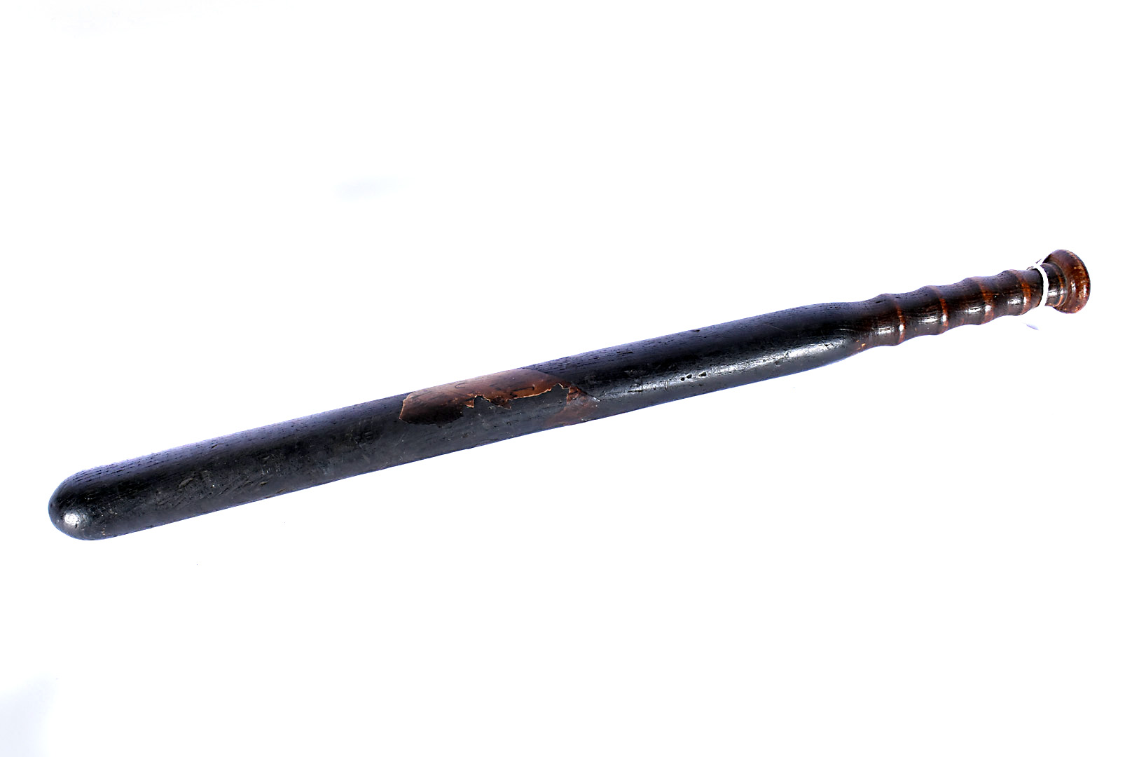 A vintage wooden truncheon, having remanence of paper label to the shaft, with hand written writing,