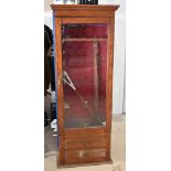 A vintage gun cabinet, having faux drawers to the bottom, with glazed top, fitting six guns,