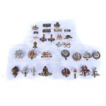 An assortment of British cap badges and titles, to include The Royal Scots, Royal Artillery,