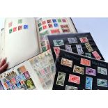A collection of British and World stamps, in two Stanley Gibbons ring binder folders, a school boy