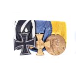 A German medal group, comprising the Iron Cross, WWI Prussia Officer's Cross 25 Year Service and the