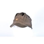A WWII period Japanese Last Ditch peak cap, having sewn on golden star to the front, brown leather