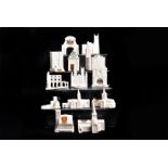 An assortment of crested churches and other buildings, to include Whitby Abbey, Carnarvon Castle,