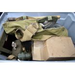 Three British WWII period gas masked, together with a selection of items, comprising entrenching