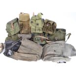 An assorted group of ten AK magazine pouches, various ages, all canvas, one with leather lining, a