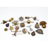 A selection of gilt and white metal sweetheart brooches and lapels, including The Welsh Fusiliers,