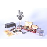 An assortment of various items, including cufflinks, pin badges, key ring, pocket knives and more (
